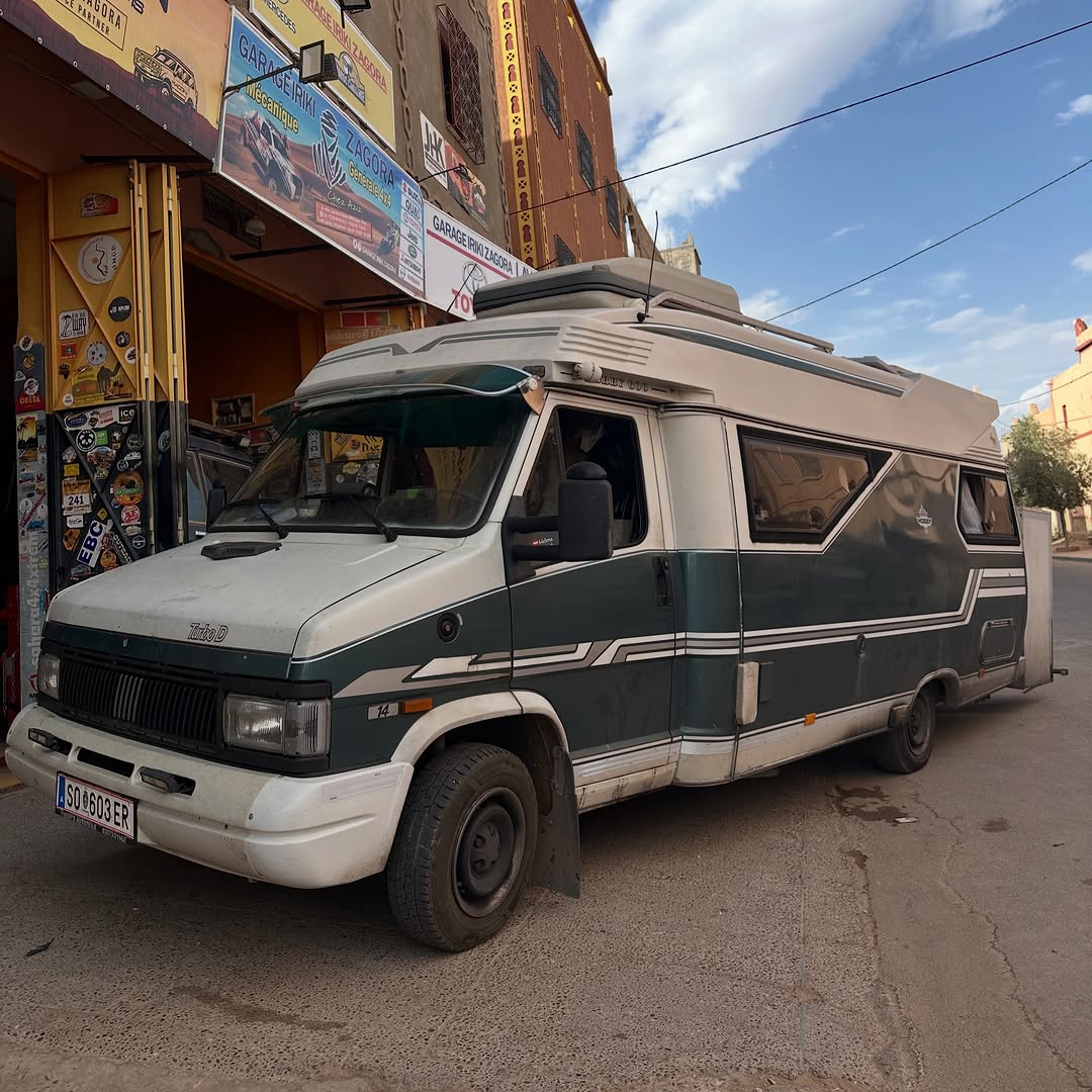 Green and white Austrian classic Turbo D camper van parked in front of Garage Iriki Zagora after suspension lift