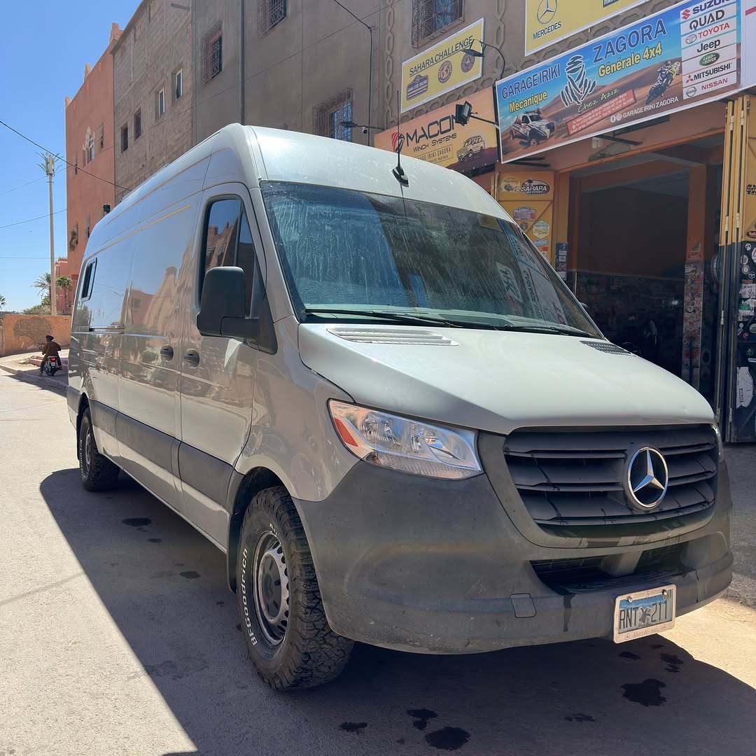 Mercedes-Benz Sprinter 2500 from Colombia parked in front of Garage Iriki in Zagora, Morocco after a suspension lift