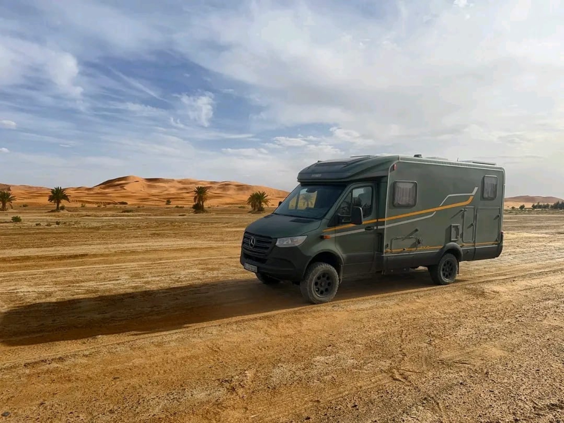 Mercedes camper travelling through the desert
