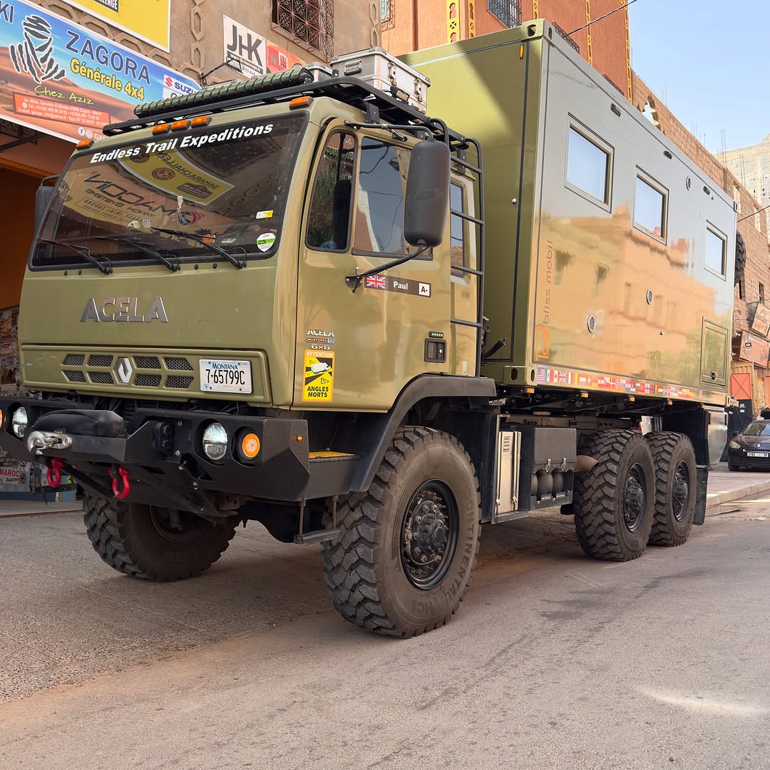 Green Acela 6x6 Bliss Mobil expedition truck with Montana plates parked outside Garage Iriki Zagora