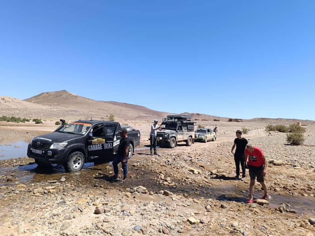 Group waiting at a wadi crossing