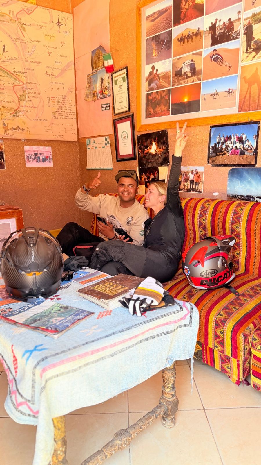 Zakaria in the office with maps and photo collages