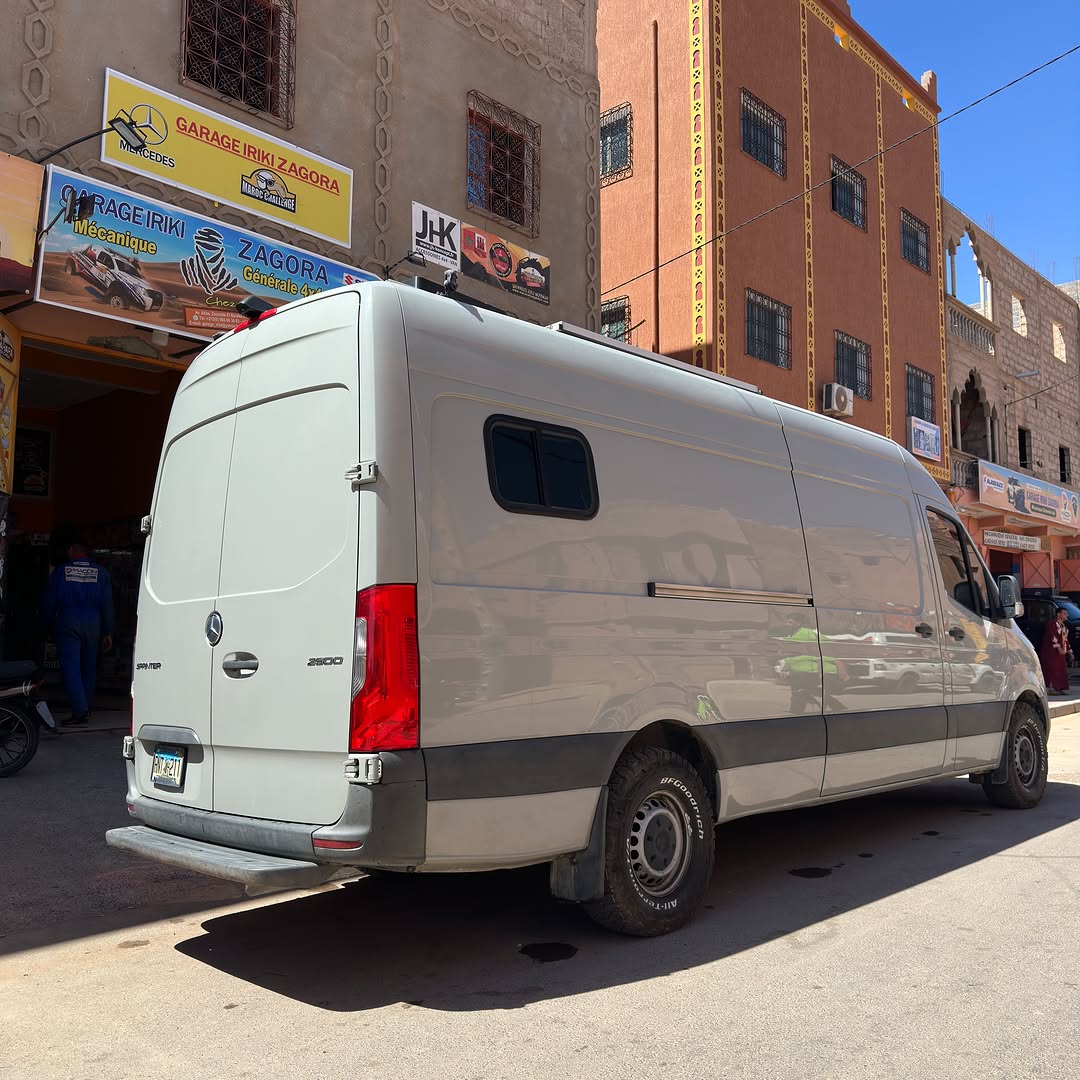 Rear three-quarter view of the Sprinter 2500 camper van after leaf spring upgrade at Garage Iriki, Zagora