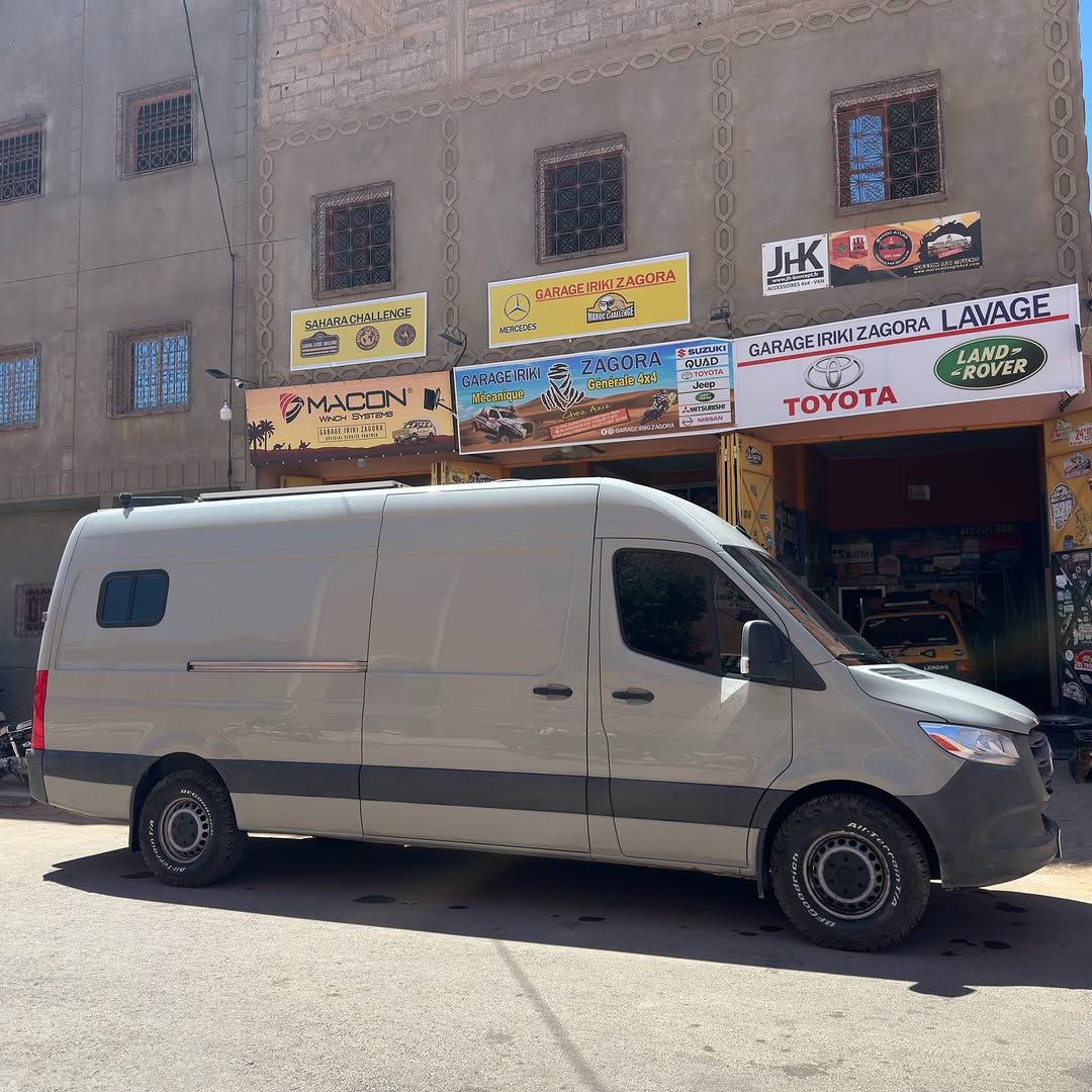 Side profile of the Colombian Sprinter overland van outside Garage Iriki Zagora with BFGoodrich all-terrain tires