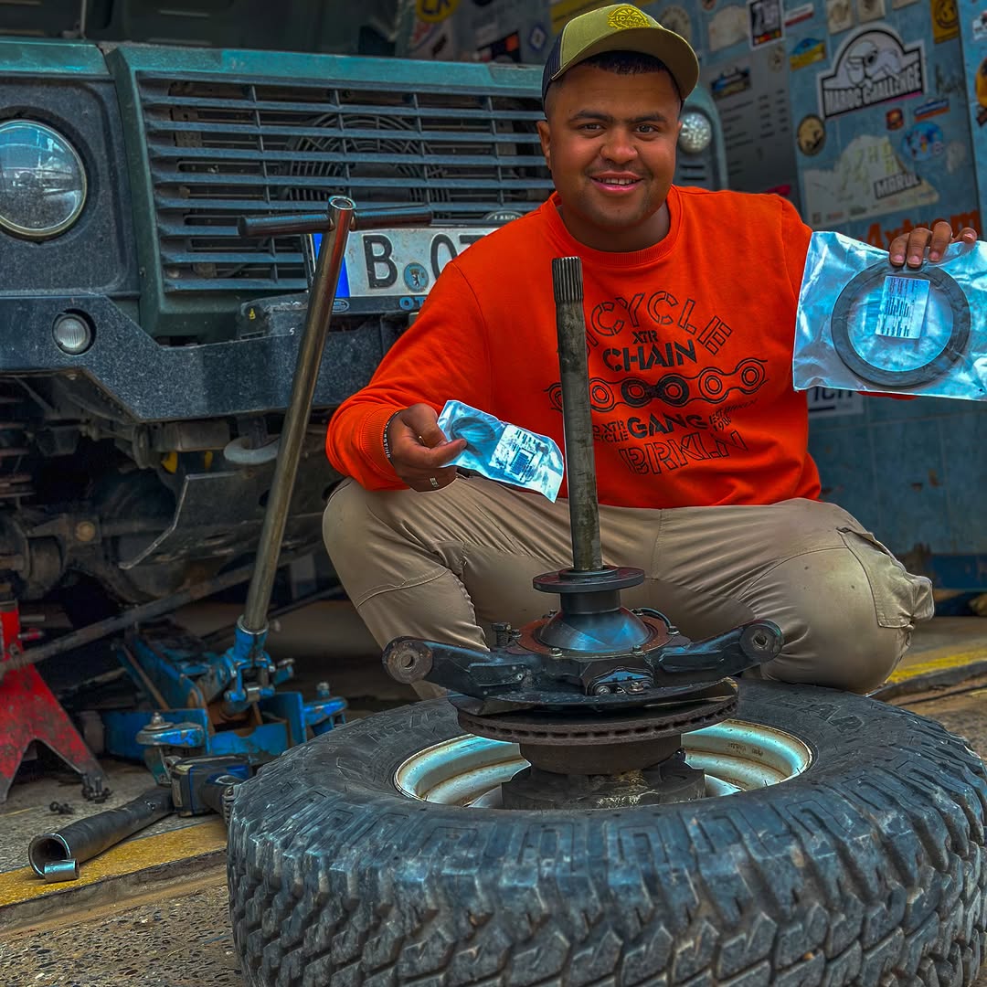 Smiling Zicaaaas mechanic with new Land Rover Defender oil seal kits at Garage Iriki, Zagora