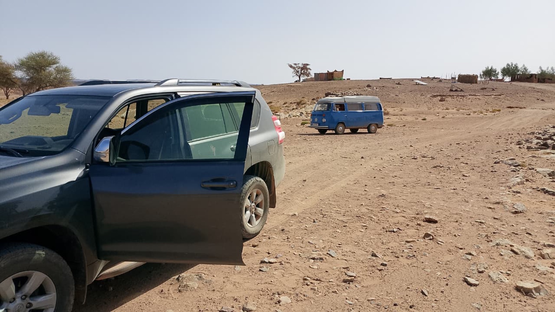 Overland vehicles gathered on a remote route